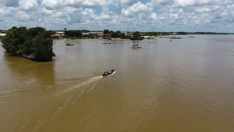 Aerial-shot-of-a-canoe-on-Mana-river-Saint-Laurent-du-Maroni-Guiana.-Shipwreck